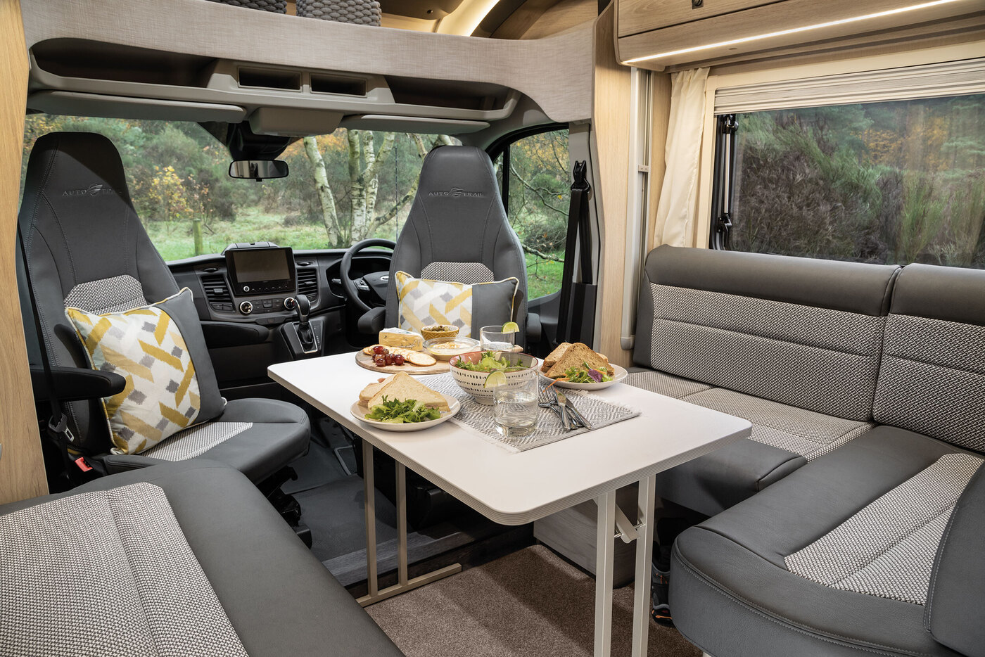 Auto-Trail F-Line F60 (2024) front lounge and half-dinette